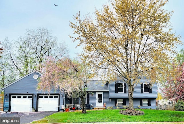 111 Sue Ann Ct, Sterling, VA 20164 - split level home featuring an attached garage and asphalt driveway