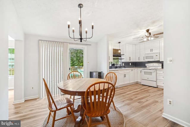 111 Sue Ann Ct, Sterling, VA 20164 - dining area with light wood-style floors, a ceiling fan, a chandelier, and a textured ceiling