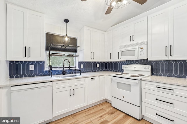 111 Sue Ann Ct, Sterling, VA 20164 - kitchen with white appliances, ceiling fan, light wood-style floors, white cabinetry, and tasteful backsplash
