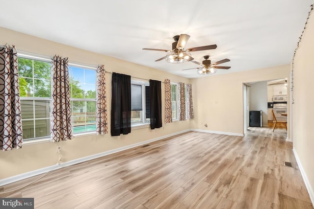 111 Sue Ann Ct, Sterling, VA 20164 - unfurnished living room featuring light wood-style floors and a ceiling fan