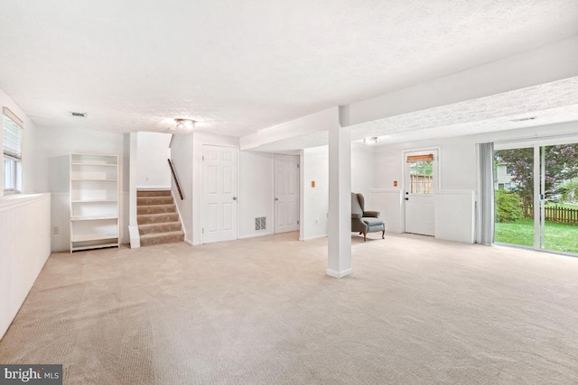 111 Sue Ann Ct, Sterling, VA 20164 - unfurnished living room featuring stairs and light colored carpet