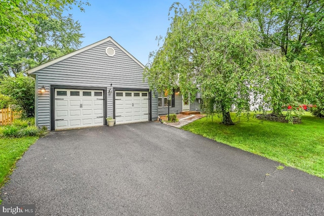 111 Sue Ann Ct, Sterling, VA 20164 - view of front of home featuring asphalt driveway, a front yard, and a garage