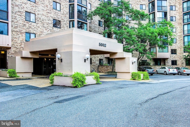 5902 Mount Eagle Dr Unit 718, Alexandria, VA 22303 - view of apartment building / complex with uncovered parking