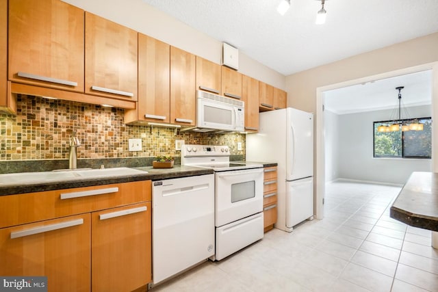 5902 Mount Eagle Dr Unit 718, Alexandria, VA 22303 - kitchen with white appliances, dark countertops, backsplash, a chandelier, and light tile patterned floors