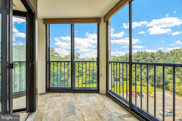 5902 Mount Eagle Dr Unit 718, Alexandria, VA 22303 - unfurnished sunroom featuring stone finish floors