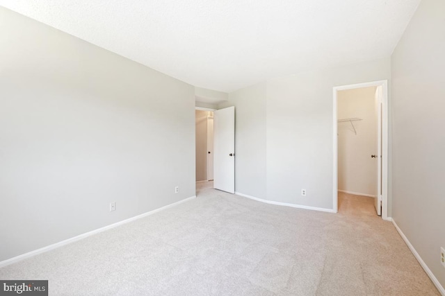 5902 Mount Eagle Dr Unit 718, Alexandria, VA 22303 - unfurnished bedroom with a walk in closet, carpet flooring, and a closet