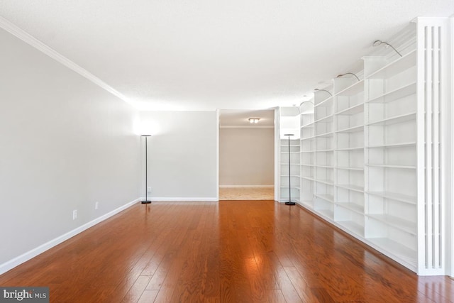 5902 Mount Eagle Dr Unit 718, Alexandria, VA 22303 - empty room featuring ornamental molding, wood finished floors, and built in shelves