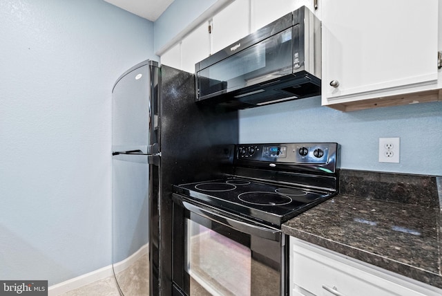 3315 Wyndham Cir Unit 1223, Alexandria, VA 22302 - kitchen with black appliances, white cabinetry, dark stone counters, baseboards, and light tile patterned flooring