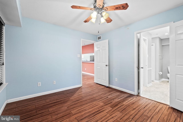 3315 Wyndham Cir Unit 1223, Alexandria, VA 22302 - unfurnished bedroom featuring wood finished floors, baseboards, and a ceiling fan