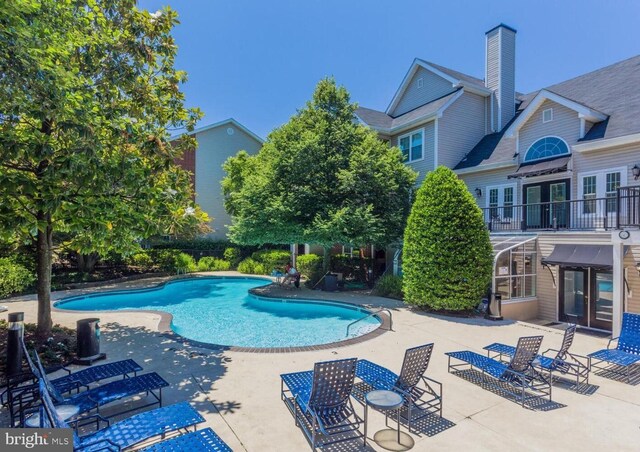 3315 Wyndham Cir Unit 1223, Alexandria, VA 22302 - community pool featuring french doors and a patio