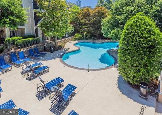 3315 Wyndham Cir Unit 1223, Alexandria, VA 22302 - community pool featuring a patio