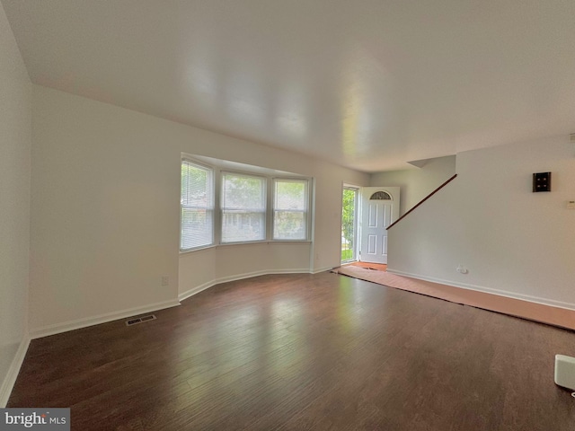 225 N New St, Dover, DE 19904 - unfurnished living room featuring wood finished floors