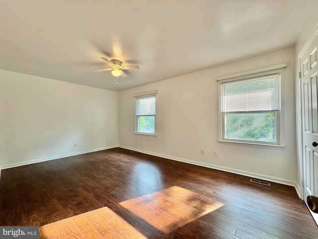 225 N New St, Dover, DE 19904 - empty room with dark wood-style flooring and a ceiling fan