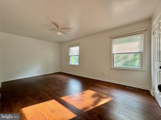 225 N New St, Dover, DE 19904 - empty room with dark wood finished floors and a ceiling fan