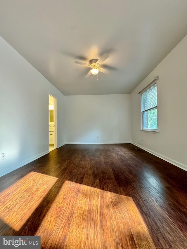 225 N New St, Dover, DE 19904 - spare room featuring ceiling fan and dark wood-style floors