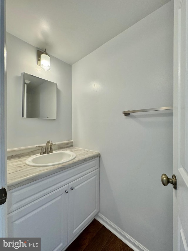 225 N New St, Dover, DE 19904 - bathroom featuring vanity and wood finished floors
