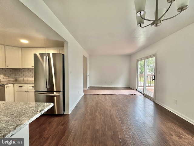 225 N New St, Dover, DE 19904 - unfurnished dining area with dark wood finished floors and a chandelier