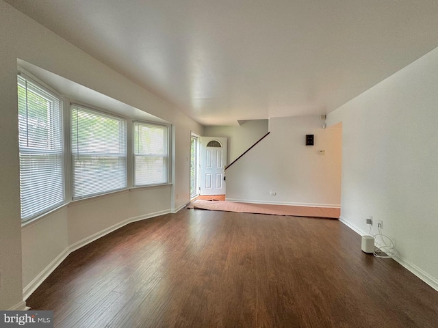 225 N New St, Dover, DE 19904 - unfurnished living room featuring dark wood-style floors