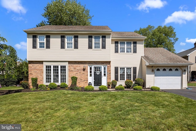 3 Adrian Pl, Newtown, PA 18940 - colonial-style house featuring a garage, a front yard, asphalt driveway, and brick siding