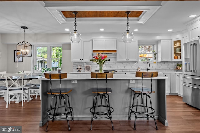 3 Adrian Pl, Newtown, PA 18940 - kitchen featuring high end refrigerator, a raised ceiling, white cabinets, light countertops, and crown molding