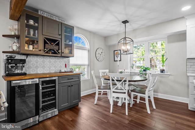 3 Adrian Pl, Newtown, PA 18940 - dining area with beverage cooler, wet bar, baseboards, and dark wood-type flooring