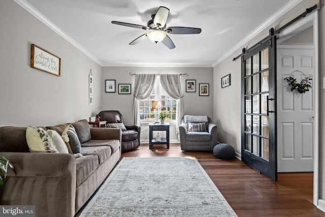 3 Adrian Pl, Newtown, PA 18940 - living room with a barn door, ceiling fan, dark wood finished floors, and crown molding
