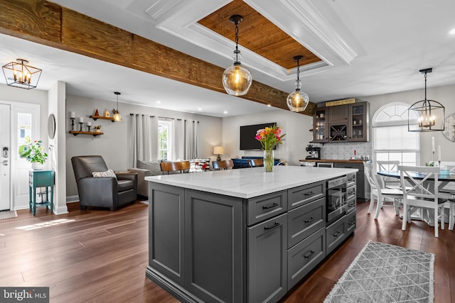 3 Adrian Pl, Newtown, PA 18940 - kitchen featuring a chandelier, gray cabinets, a kitchen island, open floor plan, and glass insert cabinets