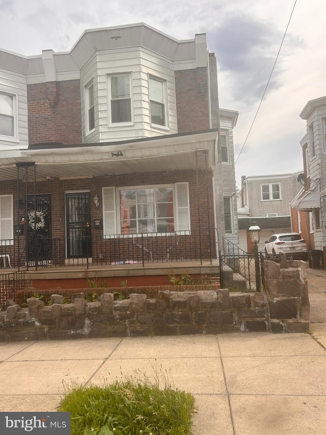 4726 Princeton Ave, Philadelphia, PA 19135 - view of property featuring a porch and brick siding
