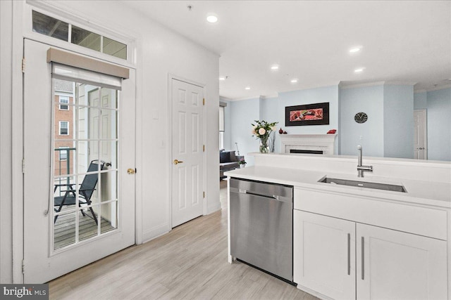 110 Chevy Chase St Unit 301, Gaithersburg, MD 20878 - kitchen with stainless steel dishwasher, a sink, white cabinets, light wood-style flooring, and recessed lighting