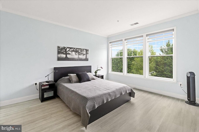 110 Chevy Chase St Unit 301, Gaithersburg, MD 20878 - bedroom featuring baseboards, crown molding, and light wood-style flooring