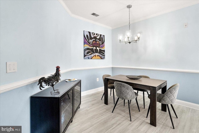 110 Chevy Chase St Unit 301, Gaithersburg, MD 20878 - dining space featuring wood finished floors, a chandelier, crown molding, and baseboards