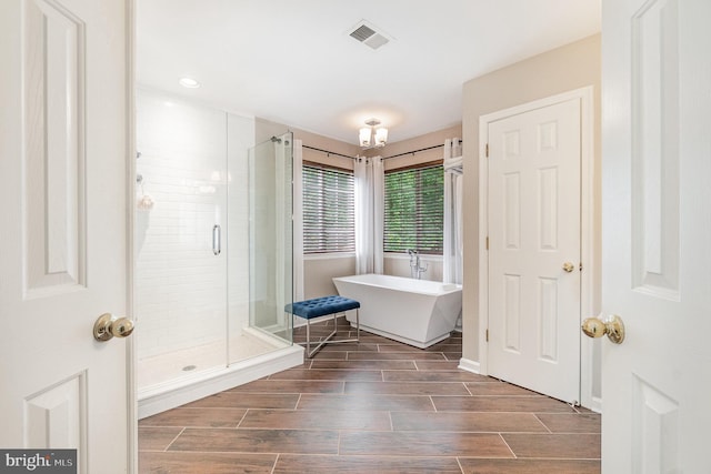 25 Crescent Links Dr, North East, MD 21901 - bathroom with a freestanding bath, a stall shower, wood tiled floors, and recessed lighting
