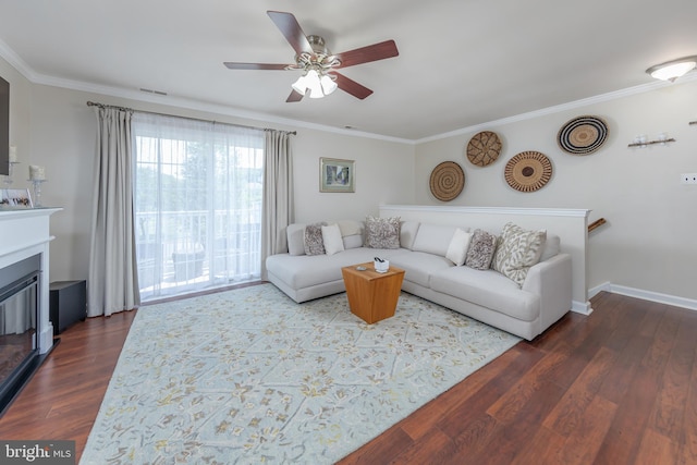 606 Yorkshire Ct, Sewell, NJ 08080 - living room with a ceiling fan, ornamental molding, dark wood finished floors, a glass covered fireplace, and baseboards