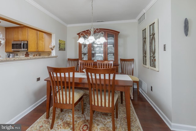 606 Yorkshire Ct, Sewell, NJ 08080 - dining room with a chandelier, dark wood-style floors, crown molding, and baseboards