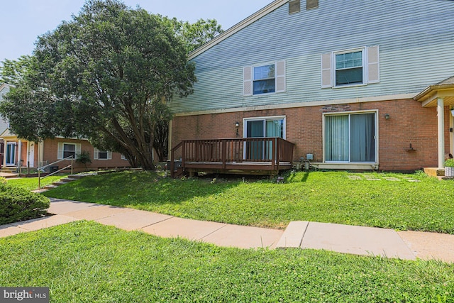 15 Woodenbridge Ct Unit C, Reisterstown, MD 21136 - exterior space with a wooden deck, a yard, and brick siding