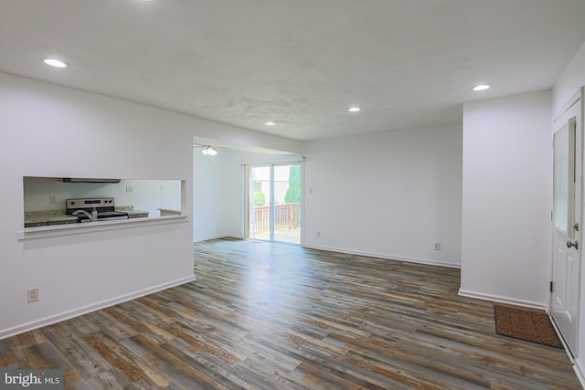 15 Woodenbridge Ct Unit C, Reisterstown, MD 21136 - unfurnished living room featuring dark wood-style floors and recessed lighting