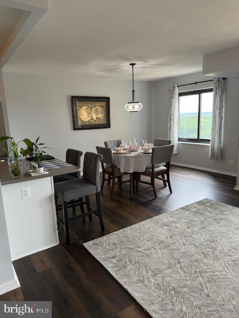 309 Yoakum Pkwy Unit 1809, Alexandria, VA 22304 - dining room featuring dark wood-style flooring