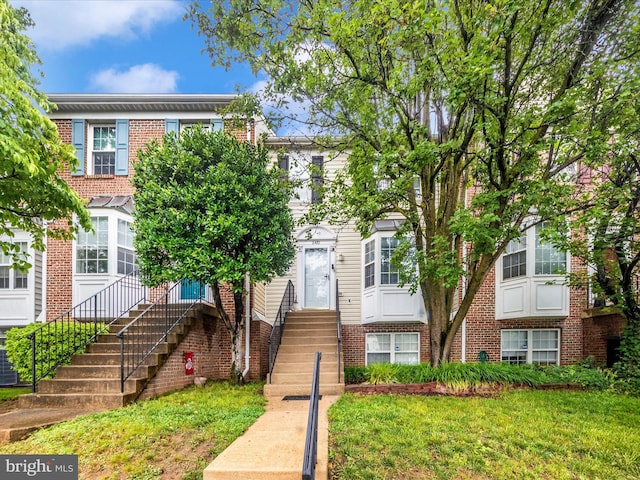 2482 Wentworth Dr Unit 2482, Crofton, MD 21114 - view of property featuring brick siding, a front lawn, and entry steps