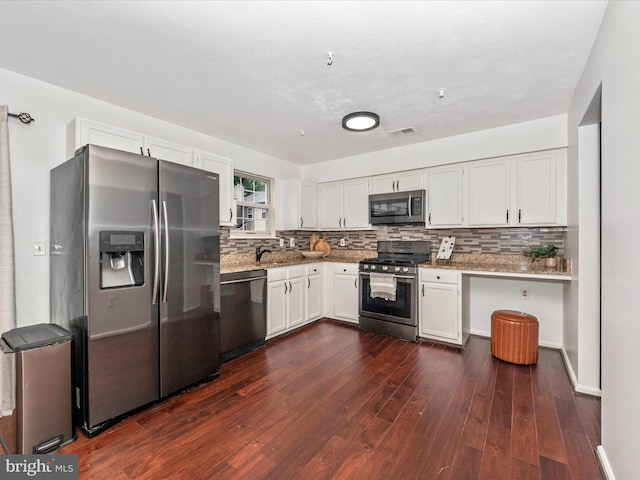 2482 Wentworth Dr Unit 2482, Crofton, MD 21114 - kitchen featuring appliances with stainless steel finishes, white cabinetry, dark wood finished floors, and tasteful backsplash