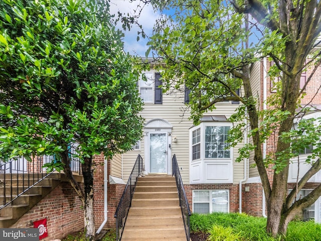 2482 Wentworth Dr Unit 2482, Crofton, MD 21114 - townhome / multi-family property with brick siding and stairway