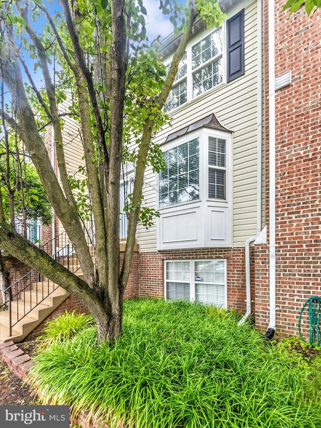 2482 Wentworth Dr Unit 2482, Crofton, MD 21114 - view of property exterior with stairway and brick siding