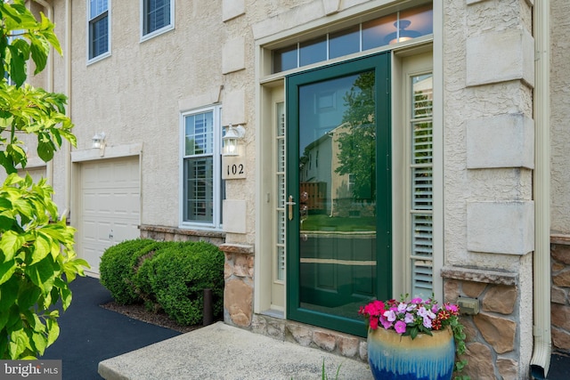 102 Warwick Way N, Wales, PA 19454 - entrance to property featuring a garage and stucco siding