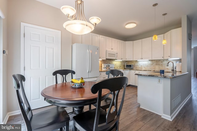 102 Warwick Way N, Wales, PA 19454 - dining space with wood finished floors and baseboards