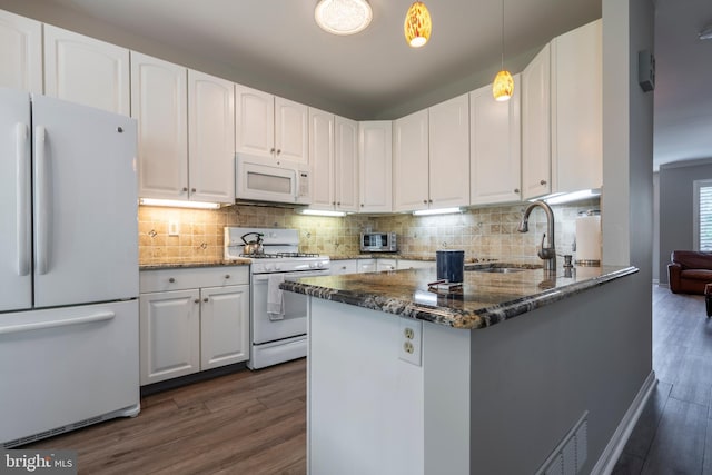 102 Warwick Way N, Wales, PA 19454 - kitchen featuring white appliances, a sink, dark wood-style floors, and dark stone counters