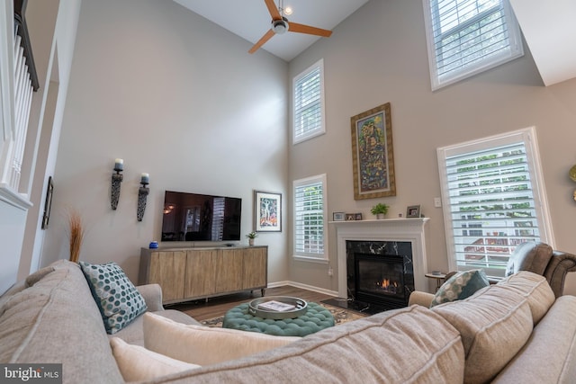 102 Warwick Way N, Wales, PA 19454 - living room featuring high vaulted ceiling, a ceiling fan, wood finished floors, a premium fireplace, and baseboards