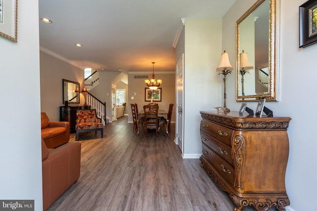 102 Warwick Way N, Wales, PA 19454 - living room with stairway, a chandelier, dark wood-style floors, ornamental molding, and baseboards
