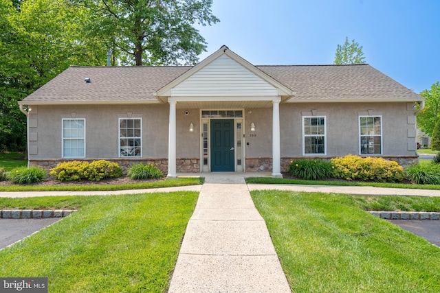 102 Warwick Way N, Wales, PA 19454 - view of front of property with stone siding, a front lawn, roof with shingles, and stucco siding