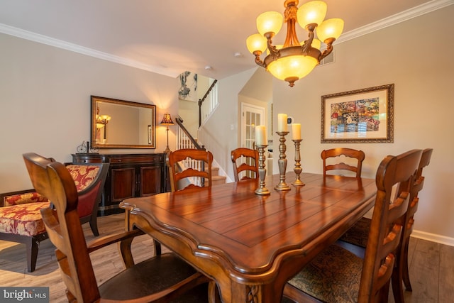 102 Warwick Way N, Wales, PA 19454 - dining space with a chandelier, wood finished floors, ornamental molding, baseboards, and stairway