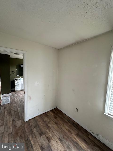 121 Defense Ct, Hedgesville, WV 25427 - empty room with dark wood-style floors and a textured ceiling