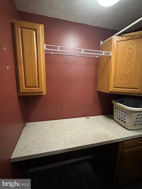 121 Defense Ct, Hedgesville, WV 25427 - laundry area featuring a textured ceiling